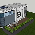 Modern Tiny Guesthouse With Large Glass Windows And Wooden Deck On Green Lawn