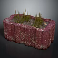 Green Grass Like Plants Growing In Red Rectangular Stone Planter With Mottled Texture