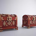 Pair of Red Treasure Chests With Gold Decorative Accents And Intricate Carvings