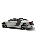 White Audi Sports Car With Sleek Exterior Black Doors And Alloy Wheels