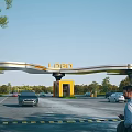 Modern Entrance Gate Structure With LOGO Vehicles Passing And Trees Along Road