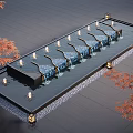 Illuminated Water Fountain with Red Maple Leaves Flowing Water and Gray Stone Tile Floor