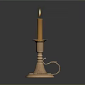 Antique Brass Candle Lamp With Lit Yellow Candle And Decorative Reflective Base