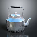 Silver Metal Kettle with Black Handle Round Lid and Spout as Essential Household Item