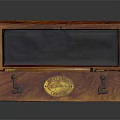 Open Antique Wooden Box Featuring Brass Fittings And Metal Components Inside