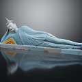 Handcrafted Reclining Buddha Sculpture In Blue Jade With Yellow Decorative Accent And Reflective Base