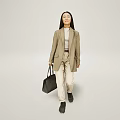 Professional Woman In Beige Blazer And Light Pants Walking With Black Handbag On Neutral Background