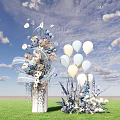 Elegant Floral Display With White Light Blue Balloons On Green Grass Under Blue Sky