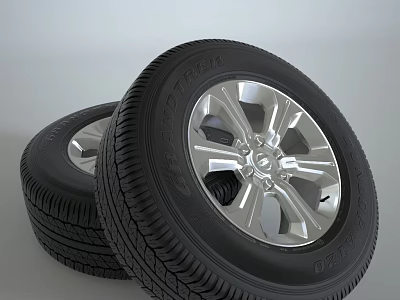 Two Modern Car Tires Featuring Shiny Silver Rims And Detailed Tread Patterns 3d model