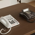Two Digital Telephones White And Black With Keypad And Handset On Wooden Table