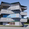 Hexagonal Guesthouse Building With Blue Roof And Multi Story Design Central Courtyard And Paved Ground