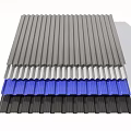 Stacked Corrugated Metal Sheets In Different Colors Gray White Blue And Dark Gray