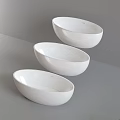 Modern White Oval Freestanding Bathtub With Chrome Faucet In Bathroom