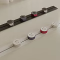 Black And White Strips With Round Sockets In Red Blue And Silver Colors