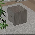 Light Wood Cube Shaped Bedside Table On Light Colored Carpet With Green Plant Leaves