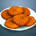 Delicious Golden Round Textured Pastries Served On White Plate For Tea Time