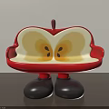 Apple Shaped Public Chair With Red Exterior Yellow Interior And Black Legs