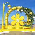 Flower Themed Photo Spot With Yellow Arch FLOWER Sign And Floral Decorations