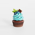 Delicious Cupcake With Light Blue Frosting Blueberries Green Leaf And Chocolate Piece