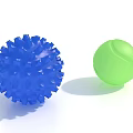 Blue Spiky Decorative Ball And Green Tennis Like Ball On White Background