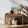 Elegant Console Table in Sunlit Interior With Textured Wall Dried Pampas Vase and Picture Frame