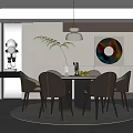 Modern Restaurant Interior Featuring Round Dining Table Chairs Pendant Light And Decorative Artwork