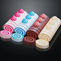Colorful Swiss Roll Cakes With Cream Flowers On Top And Spiral Cross Sections