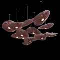Elegant Petal Shaped Chandelier Design With Textured Lampshades And Warm Lighting