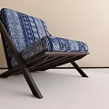 Modern Leisure Chair With Blue White Geometric Pattern And Dark Wooden Cross Leg Design
