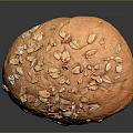 Freshly Baked Golden Round Bread Topped With Crunchy Oat Flakes And Soft Texture