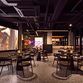 Modern Bar Interior Design With Stylish Counter Tables And Ambient Lighting