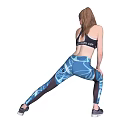 Woman Performing Stretching Exercise In Black Sports Bra And Blue Printed Leggings For Fitness Training