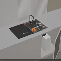 Modern White Kitchen Countertop With Black Cooktop Sink Oranges Open Cabinet And Appliances