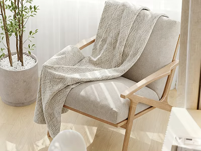 Light Gray Leisure Chair With Wooden Armrests And Textured Blanket Near Potted Plant 3d model