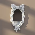 White Decorative Mirror with Bow Shaped Frame Wavy Edges on Light Brown Wall with Shadows