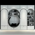 Light Blue Modern Wardrobe With Circular Seating Nook Arched Doors Open Shelves And Decorative Items