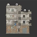 Old Multi Storey Residential Building with Peeling Walls Broken Windows Entrance Door and Rooftop Antennas