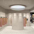 Modern Clothing Store Interior With Clothes Racks Mirror And Decorative Plant