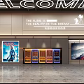 Modern Cinema Interior With Welcome Sign Movie Posters Ticket Machines And Film Reality Dream Slogan
