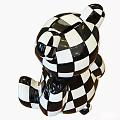 Black And White Checkered Toy Bear With Shiny Surface And Golden Foot Decorative Details