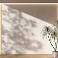 Warm Textured Wall With Light Shadow And Green Plant Next To Wooden Floor