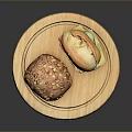 Fresh Homemade Breads on Wooden Round Tray One with Pumpkin Seeds and Sliced with Cheese