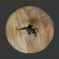 Dinosaur Model Displayed On Round Wooden Tray With Natural Texture