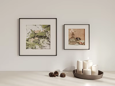 Framed Artworks On White Wall With Tabletop Candles And Decorative Pinecones 3d model
