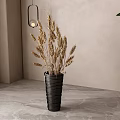 Black Woven Vase Holding Dried Wheat Ears in Interior with Light Wall and Green Plant