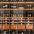 Modern Wine Cabinet With Glass Doors Displaying Wine Bottles Wine Glasses And Decorative Items