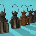 Vintage Multiple Candle Lanterns in Black and Brown With Handles on Light Blue Background