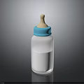 White Baby Bottle With Blue Cap And Wooden Nipple Containing Liquid For Feeding