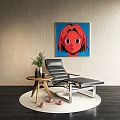 Black Lounge Chair With Wall Art Side Table Plant Round Rug And Red Balls