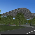 Modern School Building with Curved Roof and Sports Court Surrounded by Green Trees Near Road